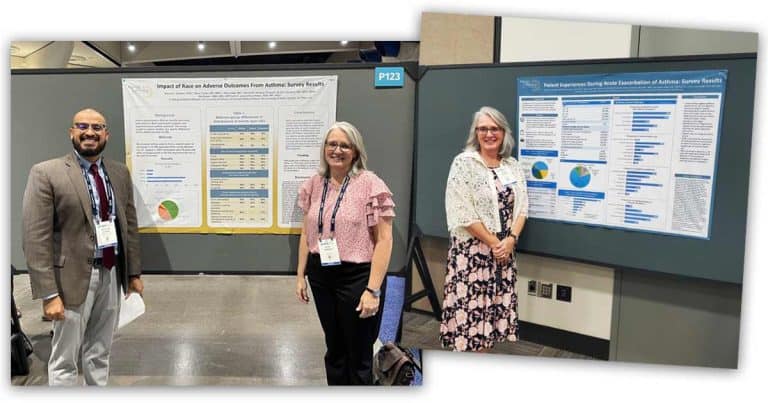 Three people stand in front of two scientific posters at a conference. The posters display charts, graphs, and text related to asthma survey results. All three are smiling and wearing conference badges.