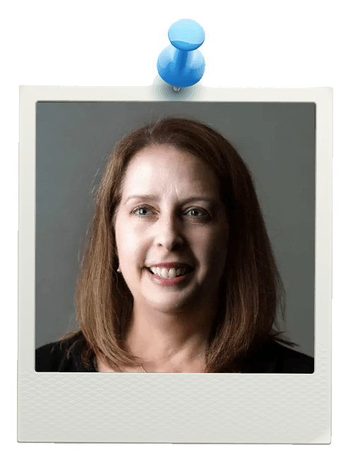 Free Asthma Coach Program 24 A woman with straight, shoulder-length brown hair smiles softly at the camera. She is wearing a black top, and the photo is framed like a Polaroid pinned to a white background with a blue pushpin.