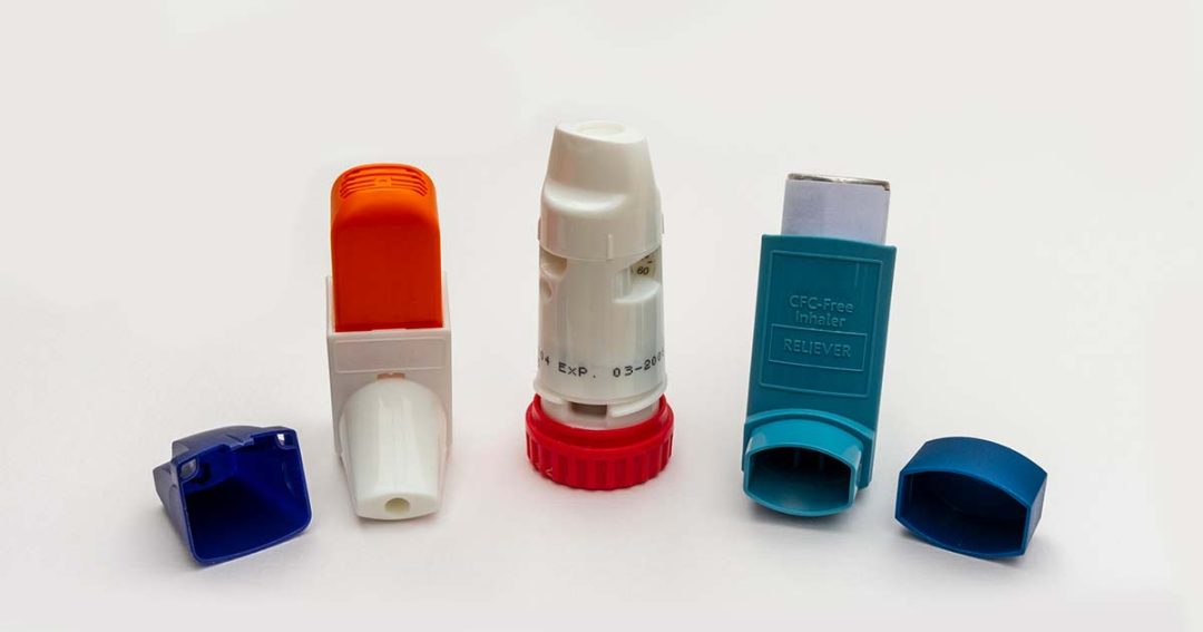 Inhaler Confusion 6 Three different asthma inhalers with their caps removed, displayed side by side on a white background. Each inhaler has its own distinct color and design.